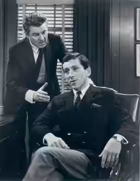 Publicity photograph release of the scene from The Edge of Night. In this photo were Laurence Hugo (left) as Mike Karr and Barry Newman as John Barnes.