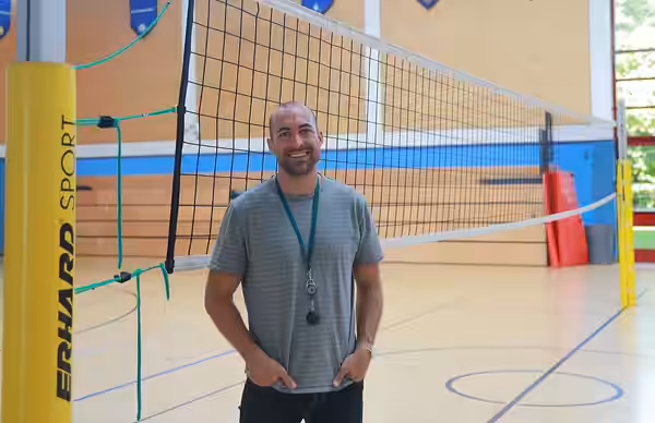 Mr. Michael Weston, the gym teacher, poses for a photo at Hohenfels Middle/High-School at the Joint Multinational Readiness Center, Germany, Aug 15, 2023. Hohen