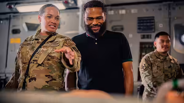 A U.S. Air Force Aeromedical Evacuation technician assigned to the 379th Expeditionary Aeromedical Evacuation Squadron, left, showcases equipment to actor Antho