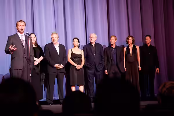Cast and crew of The Dark Knight at the European premiere in London. From left to right: Director Christopher Nolan, producers Emma Thomas and Charles Roven, ac (2008)