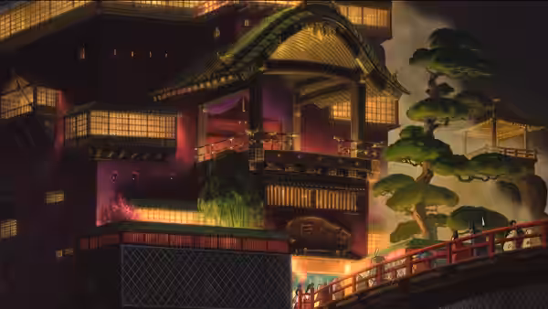 Illuminated multi-story bathhouse with bridge and pine tree at night