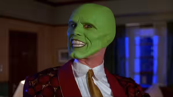 The Mask (Jim Carrey) smiles in a red patterned jacket