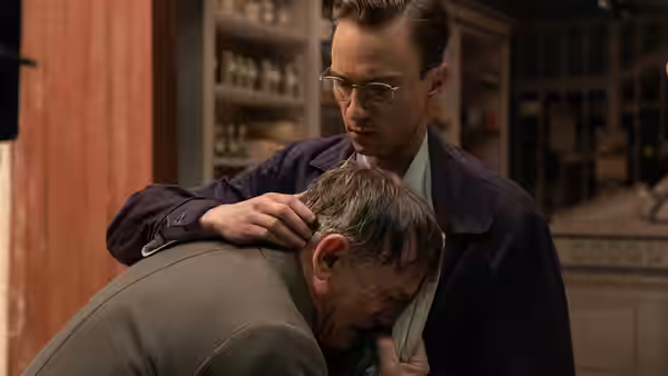 Eugene Allerton (Drew Starkey) comforts William Lee (Daniel Craig) in a room