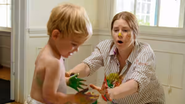 Amy Adams as Mother and young son covered in paint playing indoors