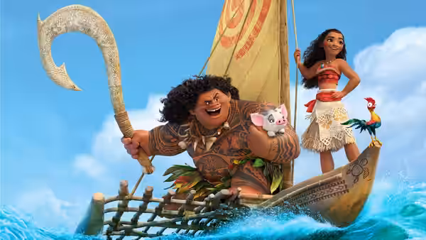 Maui (Dwayne Johnson) holding his fish hook beside Moana (Auliʻi Cravalho) on their boat