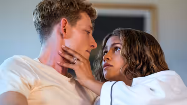Art (Mike Faist) and Tashi (Zendaya) holding each other face to face