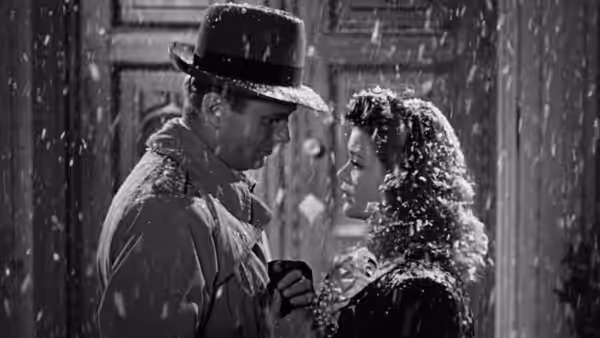 Oliver Reed and Irena Dubrovna face each other in the falling rain