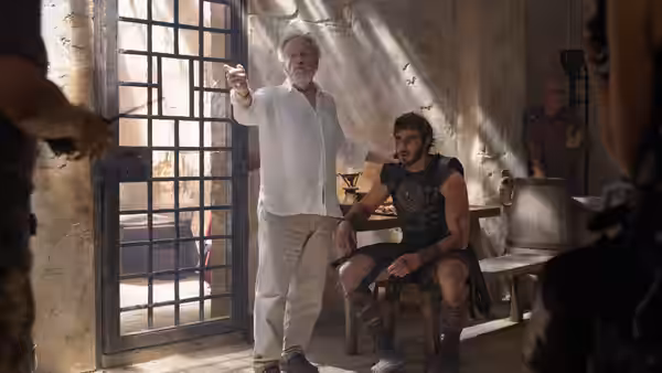 Gracchus (Derek Jacobi) standing with Lucius (Paul Mescal) in a cell