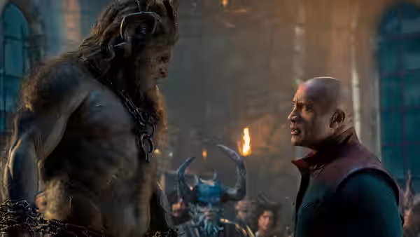 Callum Drift (Dwayne Johnson) facing a large horned beast in a dark hall