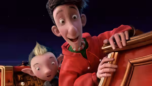 Arthur and an elf peer over the side of Santa’s sleigh
