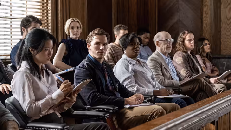 Nicholas Hoult as Justin Kemp sits among fellow jurors in a courtroom