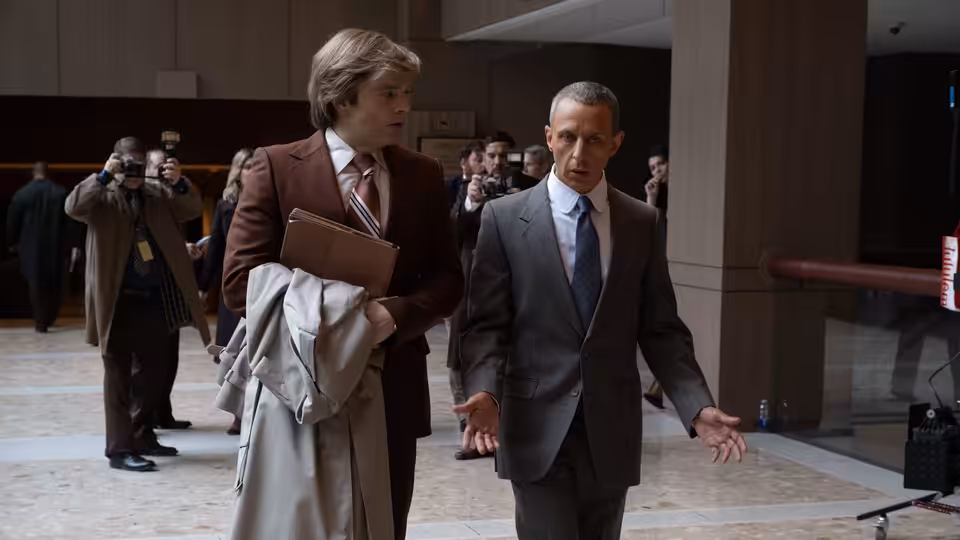Donald Trump (Sebastian Stan) walks with Roy Cohn (Jeremy Strong) through a building lobby
