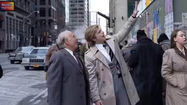 Fred Trump (Martin Donovan) stands beside Donald Trump (Sebastian Stan) on a city street