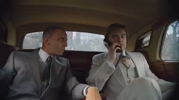 Donald Trump (Sebastian Stan) speaks on the phone while riding in a car