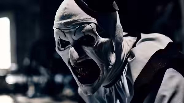 Art the Clown (David Howard Thornton) screaming in a close-up of his white mask