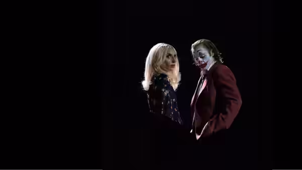 Lee Quinzel (Lady Gaga) and Joker (Joaquin Phoenix) standing face to face