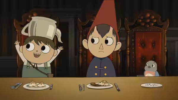 Wirt and Gregory sit at a table with plates of food