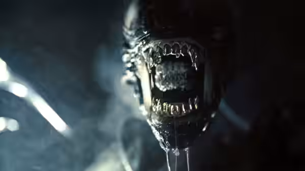 Xenomorph with open jaws dripping saliva in close-up