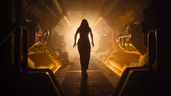 a woman walking away down a steam-filled industrial corridor