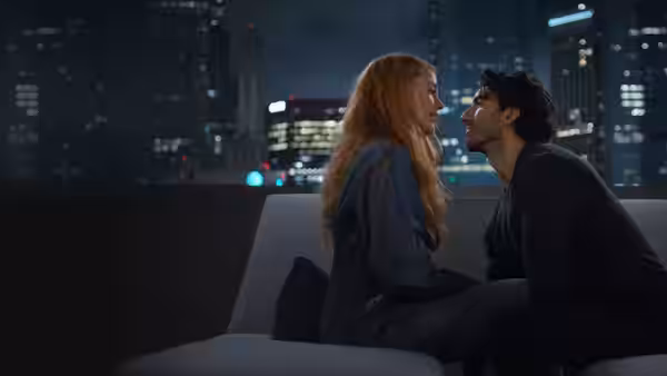 Lily Bloom (Blake Lively) and Ryle Kincaid (Justin Baldoni) sitting close on a couch