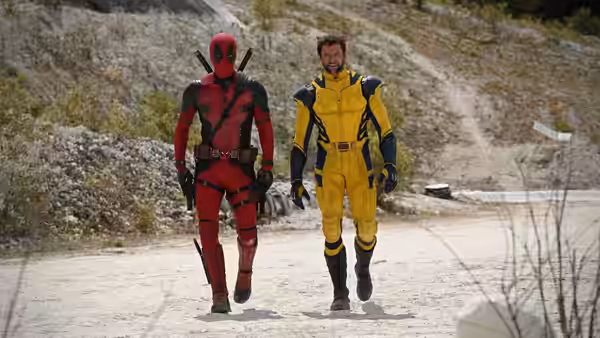 Deadpool (Ryan Reynolds) and Wolverine (Hugh Jackman) walking along a dirt path