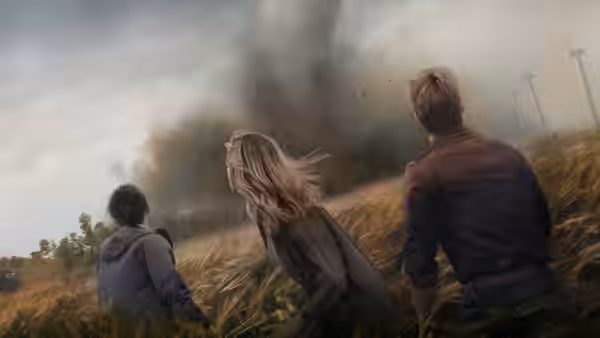 three people in a field facing a tornado under stormy skies