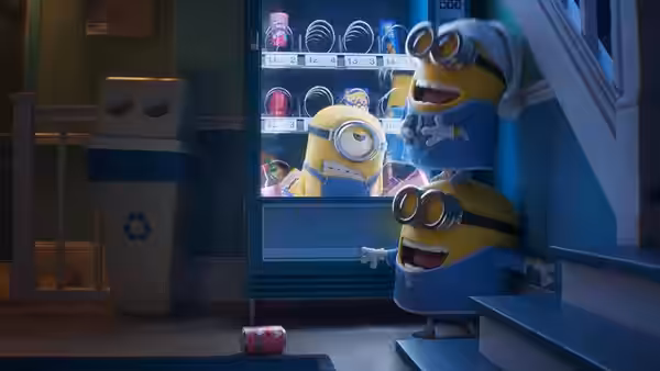 Minions in pajamas stand by an open refrigerator at night