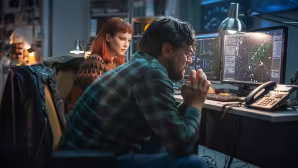 Dr. Randall Mindy (Leonardo DiCaprio) studies satellite data as Kate Dibiasky (Jennifer Lawrence) observes