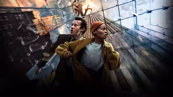 Samira (Lupita Nyong'o) and Eric (Joseph Quinn) flee through a glass passageway