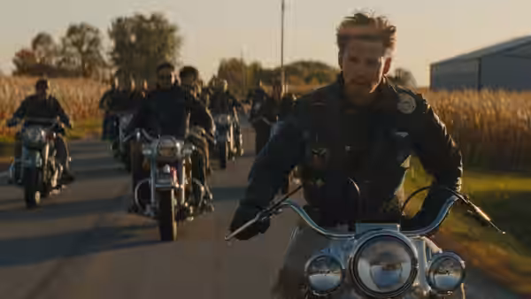 Benny (Austin Butler) leading a group of bikers on motorcycles down a road