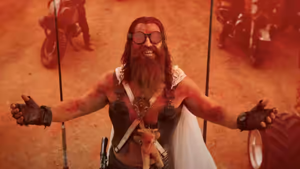Dementus (Chris Hemsworth) standing with arms outstretched in the desert