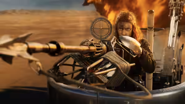 Furiosa (Anya Taylor-Joy) aiming a crossbow from a desert vehicle