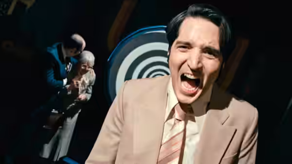 Jack Delroy (David Dastmalchian) screams on a television studio set while crew members stand behind him