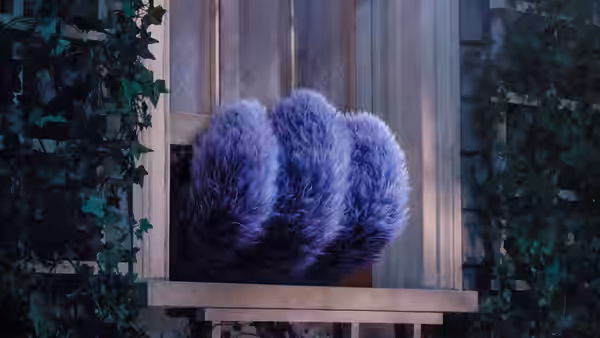 Purple furry claws rest on an outdoor windowsill