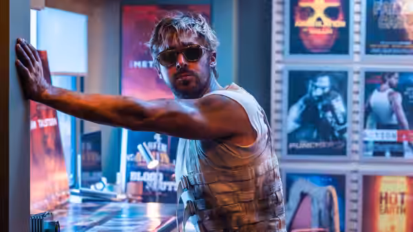 Colt Seavers (Ryan Gosling) presses his hand to a wall in a lobby