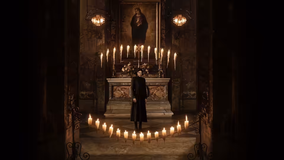 a woman in black stands among rows of candles in an ornate chapel