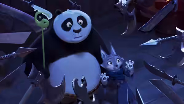Po (Jack Black) holds a staff beside Zhen (Awkwafina) amid floating weapons