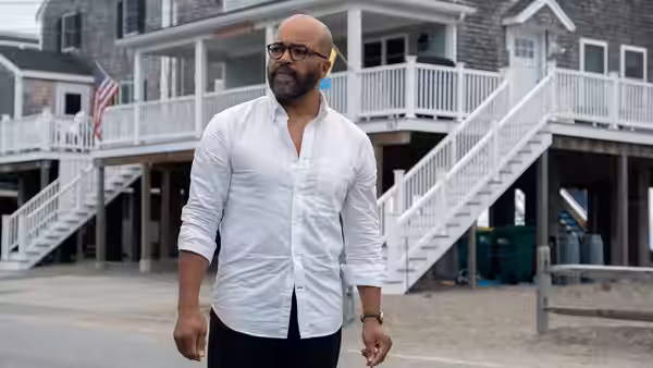 Thelonious 'Monk' Ellison (Jeffrey Wright) standing outside a large beach house