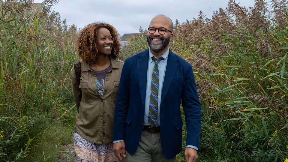 Thelonious 'Monk' Ellison (Jeffrey Wright) walking outdoors with Coraline (Erika Alexander)