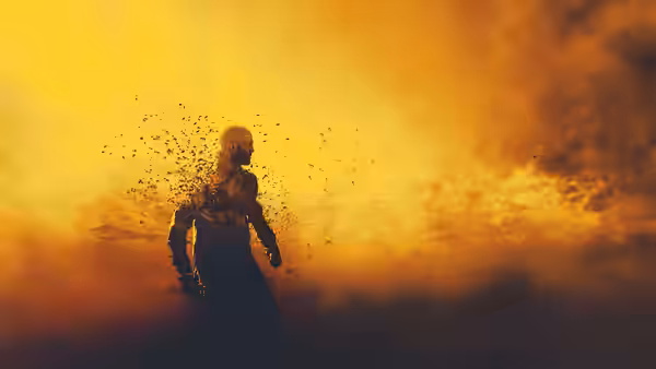 A man in a beekeeper suit breaking apart into bees against orange clouds