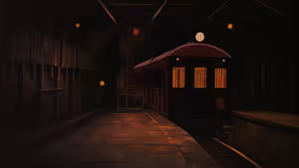 empty train platform at night with a stationary passenger train