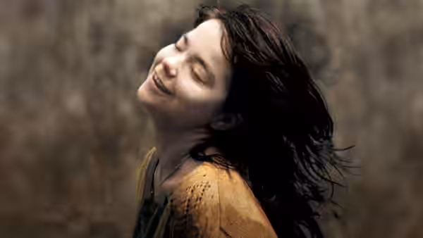 Selma Jezkova (Björk) smiling with eyes closed and head tilted back