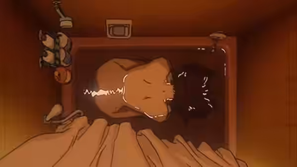 Woman lies in a small bathtub viewed from above in a bathroom
