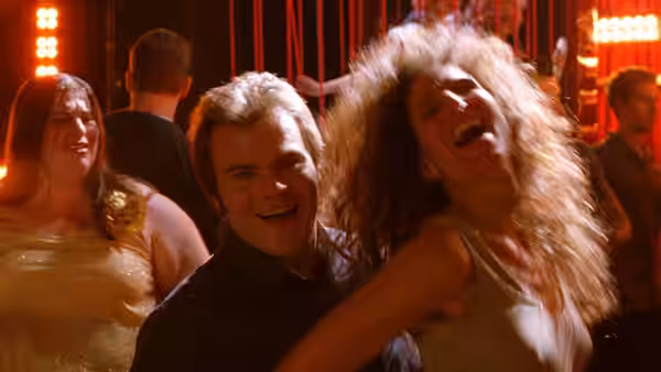 Hal (Jack Black) dances with a woman in a crowded nightclub