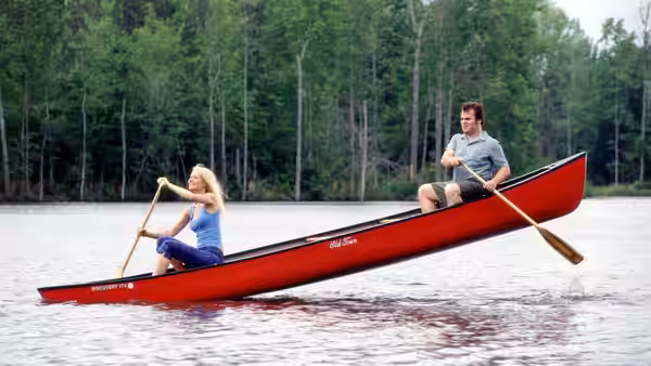 Rosemary (Gwyneth Paltrow) paddles a canoe on a lake with Hal (Jack Black)