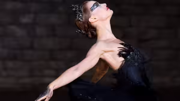 Black Swan (Natalie Portman) arching back with arm extended