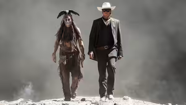Tonto (Johnny Depp) and the Lone Ranger (Armie Hammer) walking on rocky ground