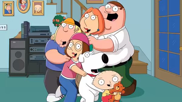 Family embracing in a living room with scared expressions