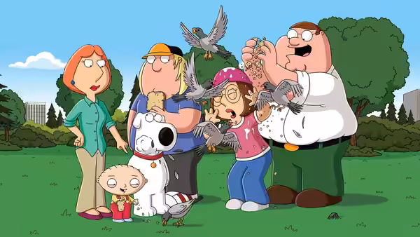 Griffin family standing in a park as birds attack them