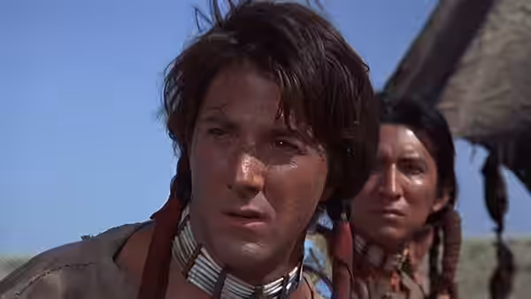 Jack Crabb (Dustin Hoffman) looks offscreen, with another man standing behind him